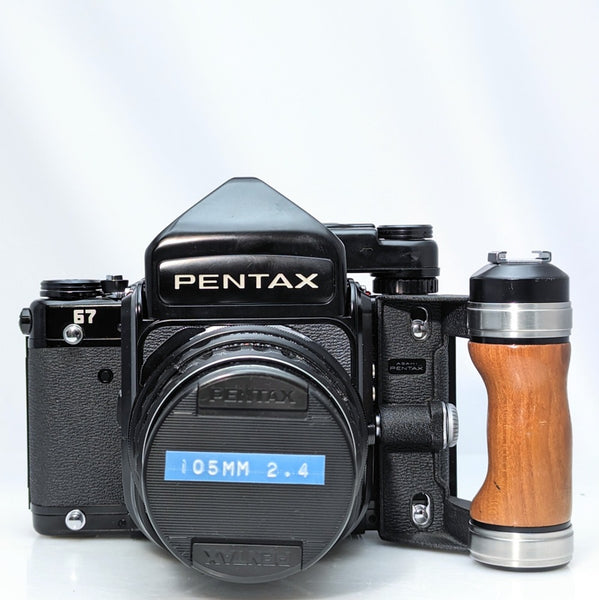 Pentax 67 SLR mirror up film camera w/Super -multi-coated Takumar 105mm  f2.4 lens, and grip
