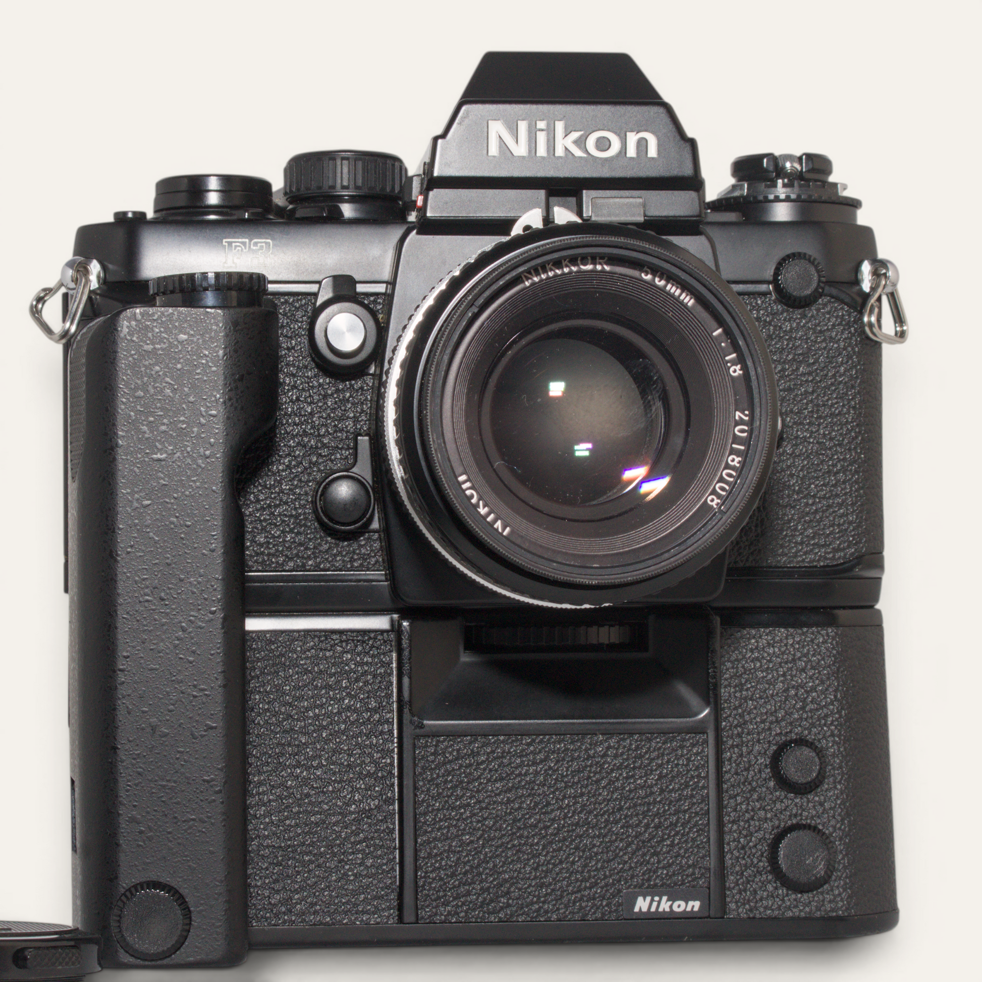 Title
Nikon F3 35mm SLR Camera w/ MD-4 Motor Drive &amp; Nikkor 50mm f/1.8 AI Lens – Used – Excellent Plus

