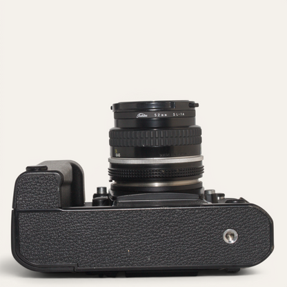 Title
Nikon F3 35mm SLR Camera w/ MD-4 Motor Drive &amp; Nikkor 50mm f/1.8 AI Lens – Used – Excellent Plus

